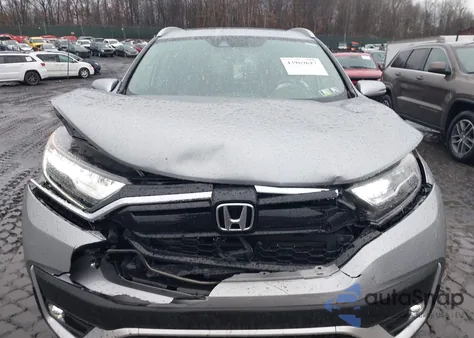 2019 Honda Cr-V Touring z USA, uszkodzony, nr VIN JHLRW2H92KX007825